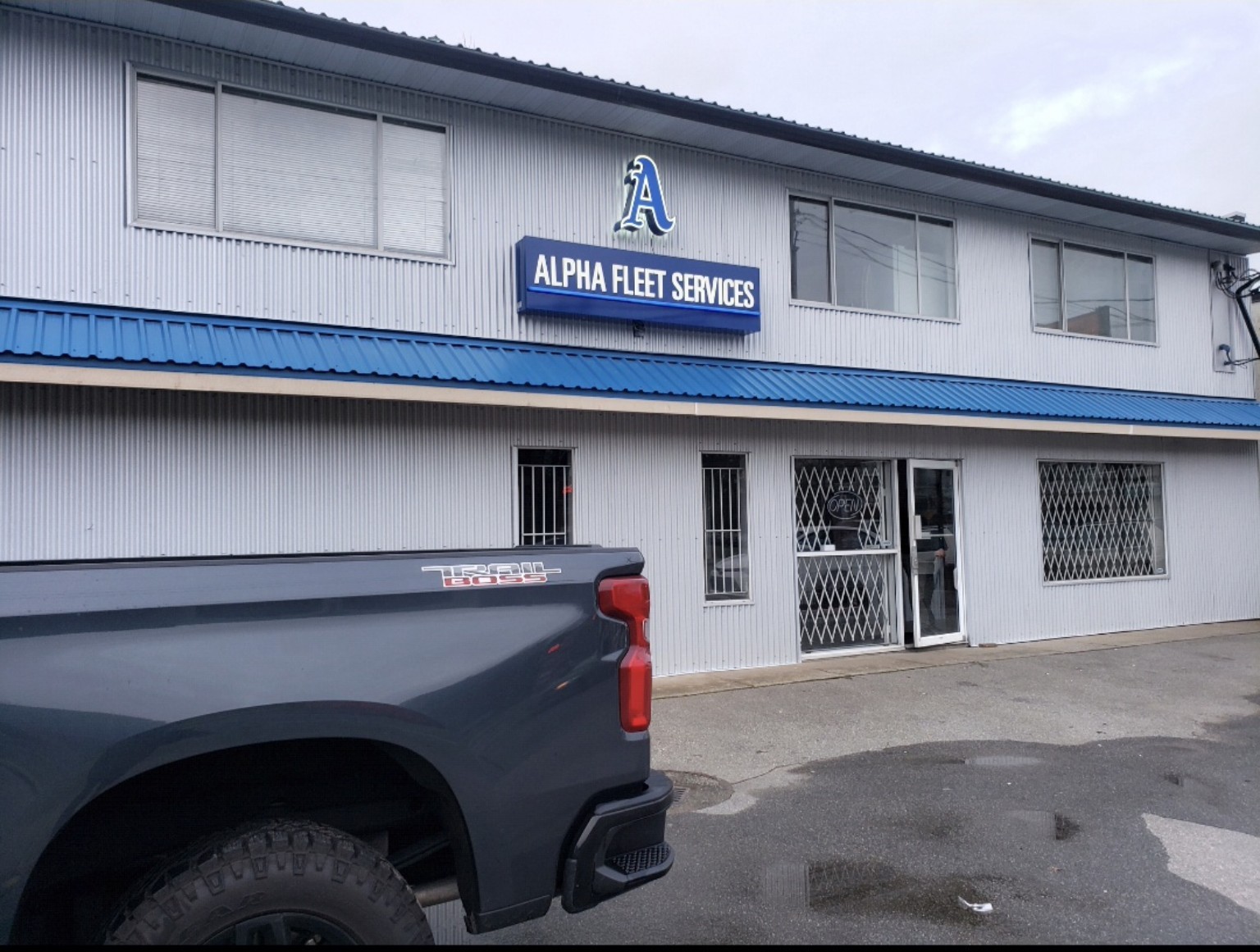 Original Alpha Fleet Services shop exterior photograph